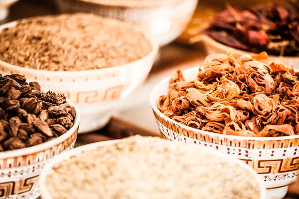 Spices and herbs in bowls. Food and cuisine ingredients. Colorful natural additives. — Stock Photo, Image