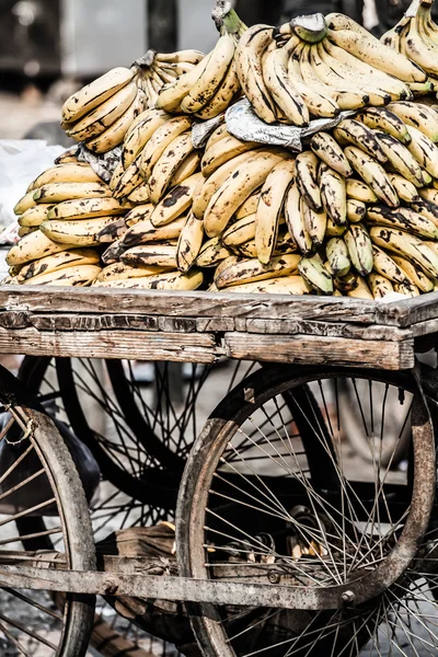 Bananas in a wheelbarrow on a fruits and vegetable market, Nepal — Stock Photo, Image