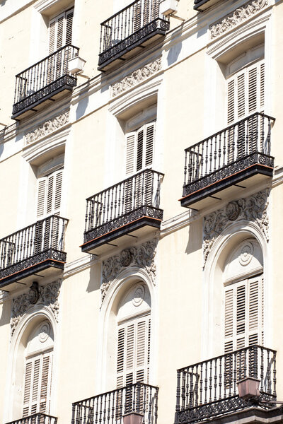 Mediterranean architecture in Spain. Old apartment building in Madrid.