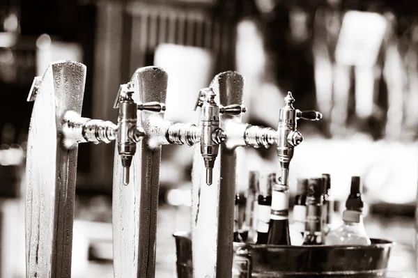 Glass of beer on pub over blurred background — Stock Photo, Image