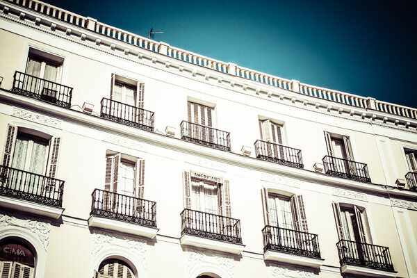 Mediterranean architecture in Spain. Old apartment building in Madrid.