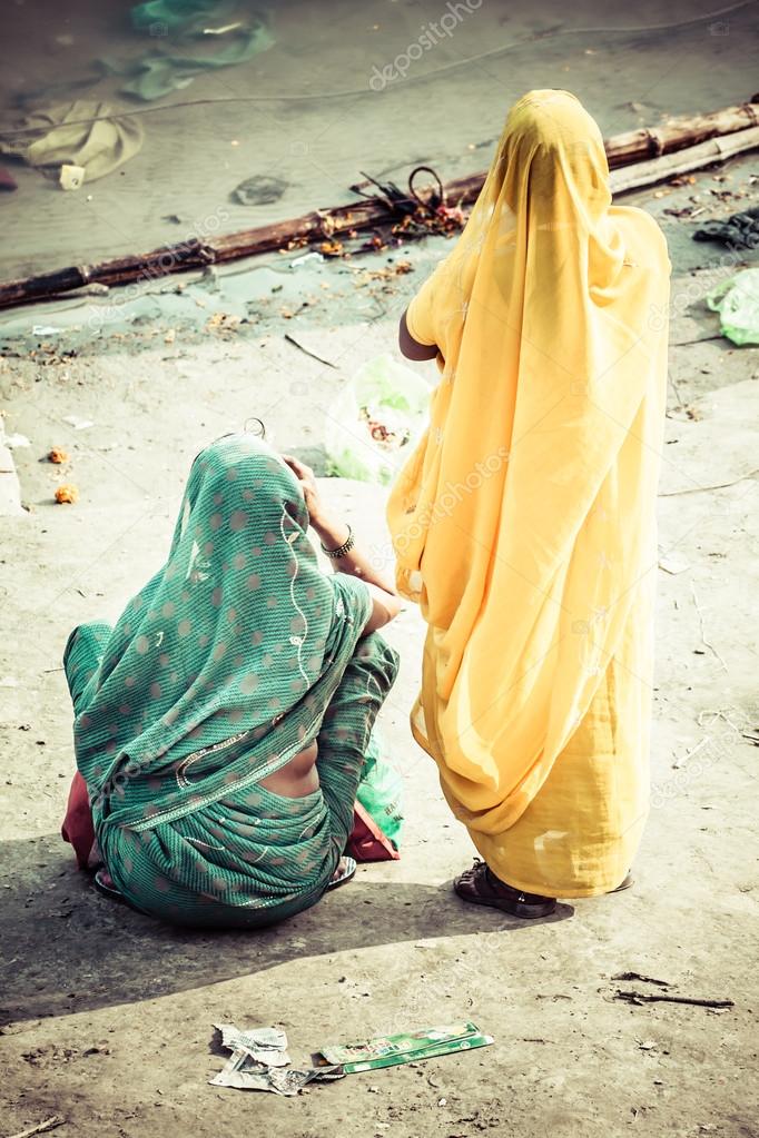 Women with colorful saris in Varanasi, India.