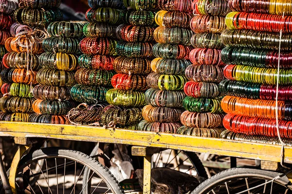 Rows of colorful wooden hand-painted bracelets — Stock Photo, Image