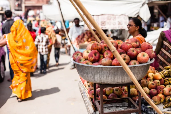 Asian farmer\'s market selling fresh apples.