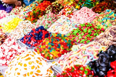 Market stall full of candys in local Israel market. clipart