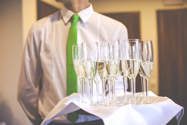 Professional waiter in uniform is serving wine — Stock Photo, Image