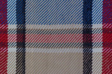 Mavi beyaz ve kahverengi renklerde kumaş desenli makro çekim.