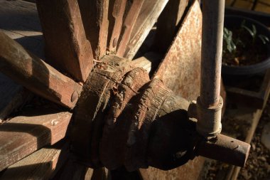 Old wagon wheel light and shadow.