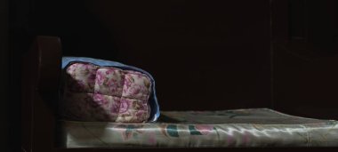 Thai wisdom block shaped pillow made with woven cloth composed of six stuffed compartments.