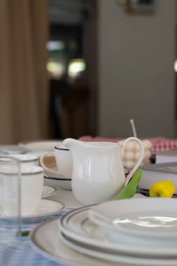 Tableware set as props on natural light background.