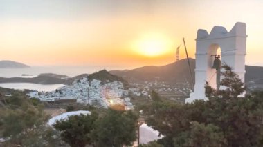 Ios Greece, beautiful sunset on the cycladic island, panoramic view from the church to the old town Chora
