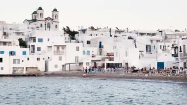 Naoussa, Paros, Greece - 27 June: general view of the main street and the landmark