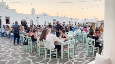 Naoussa, Paros, Greece - 10 August: people dinner in a traditional greek cafe restaurant tavern