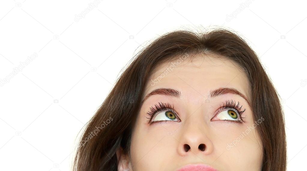 Beautiful thinking teenager girl looking up. Closeup portrait wi