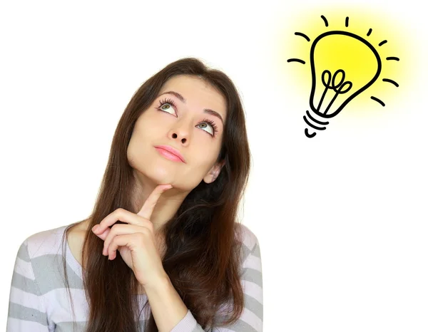 Thinking woman with idea bulb lamp above isolated on white Stock Photo