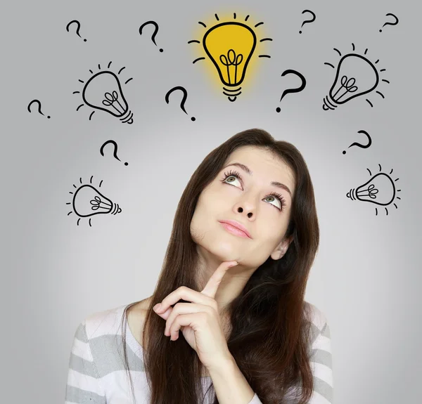 Thinking woman making dicision with looking up on idea bulb on g — Stock Photo, Image