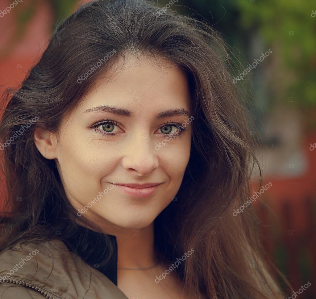 Cute Woman With Green Eyes And Long Brown Hair Looking Closeup