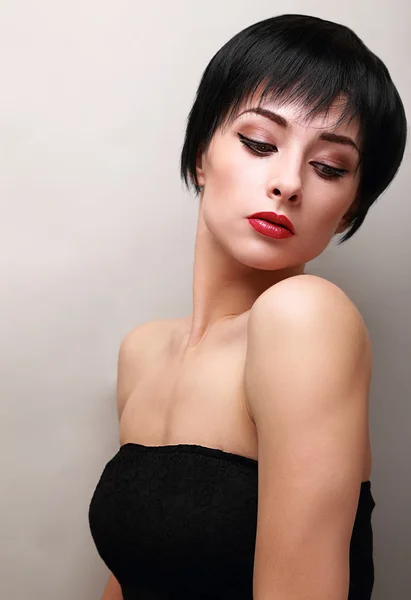 Sexy woman with black short hair styly looking down — Stock Photo, Image