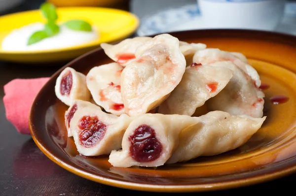 Dumplings with cherries — Stock Photo, Image