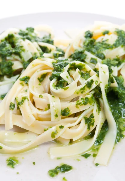 Tagliatelle with spinach on plate — Stock Photo, Image