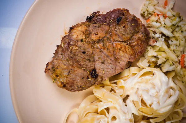 Pork neck grilled with pasta — Stock Photo, Image