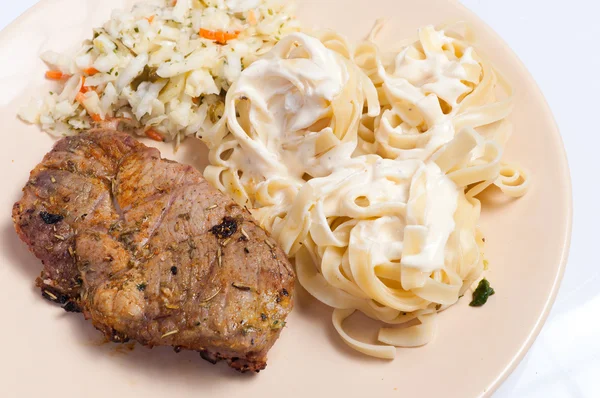 Pork neck grilled and pasta — Stock Photo, Image