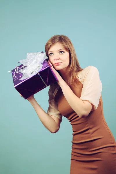 Beautiful girl with a gift. — Stock Photo, Image