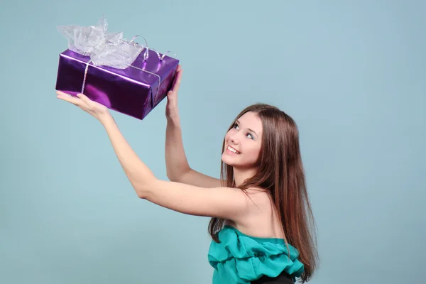 Beautiful girl with a gift. — Stock Photo, Image