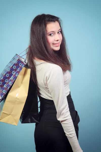 Happy girl with purchases. — Stock Photo, Image