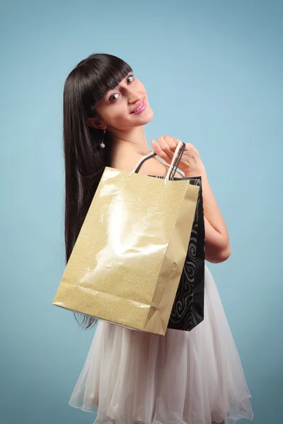 Happy girl with purchases. — Stock Photo, Image