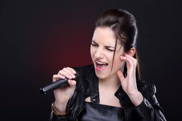 Attractive girl with microphone — Stock Photo, Image