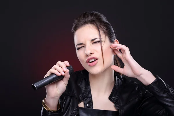 Attractive girl with microphone — Stock Photo, Image