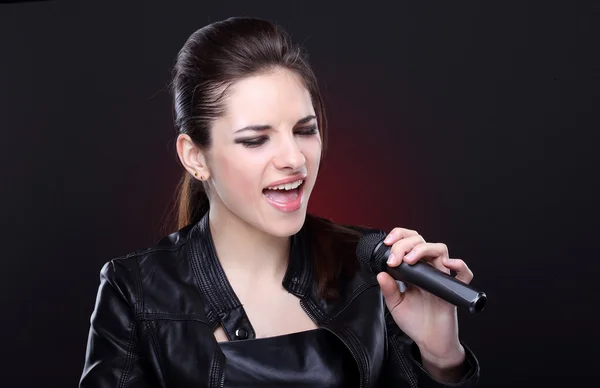 Attractive girl with microphone — Stock Photo, Image