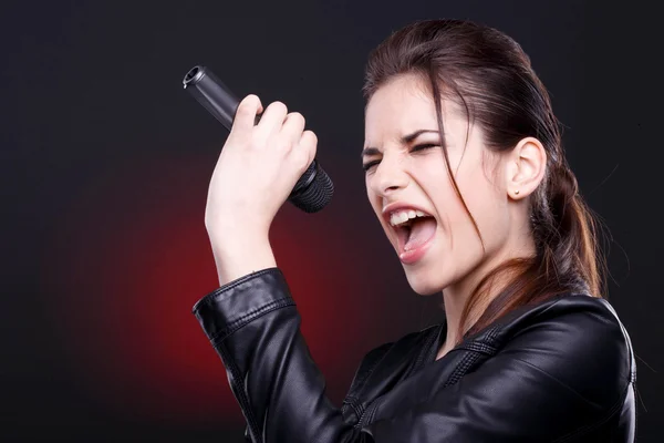 Young woman with microphone — Stock Photo, Image