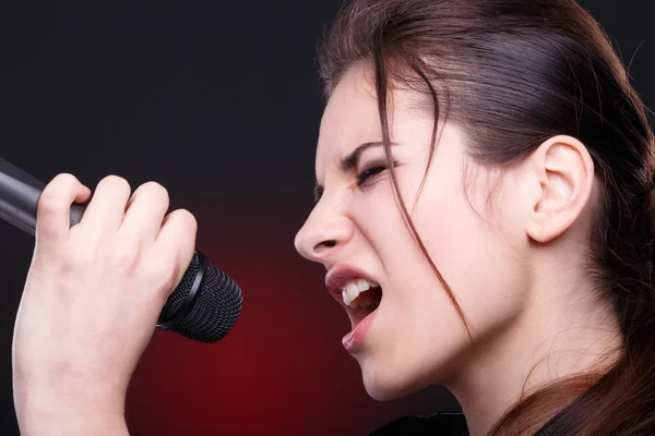 Young woman with microphone — Stock Photo, Image