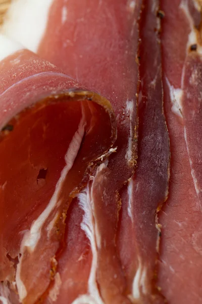 Cured ham isolated on white background — Stock Photo, Image