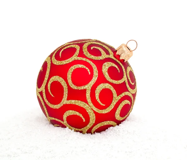 Red Chritsmas Ball lying on snow — Stock Photo, Image