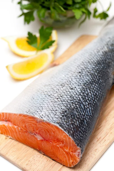 Salmon on cutting board — Stock Photo, Image