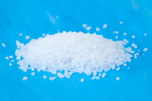 Sea salt on blue — Stock Photo, Image
