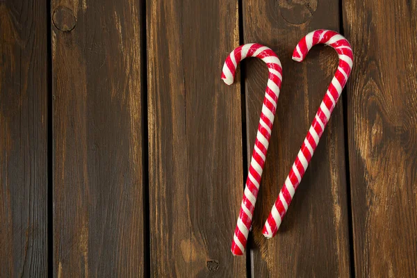 Striped Christmas Candy Cane Wooden Surface — Stock Photo, Image