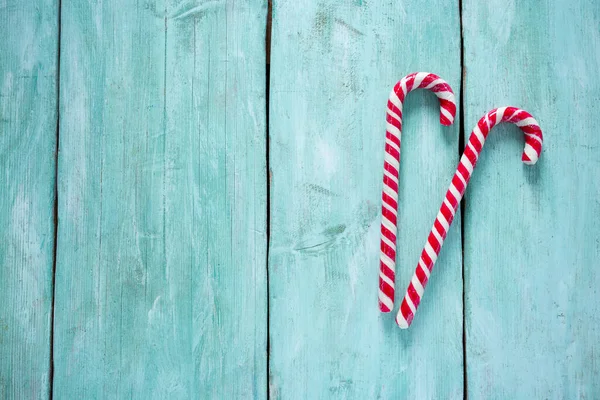 Striped Christmas Candy Cane Turquoise Surface — Stock Photo, Image