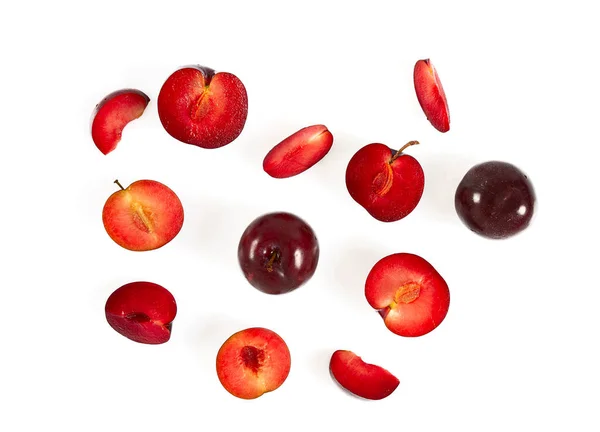 Red Cut Whole Plums Isolated White Surface Top View — Foto Stock