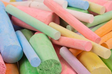 colorful pieces of chalk isolated on white background