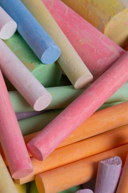 colorful pieces of chalk isolated on white background