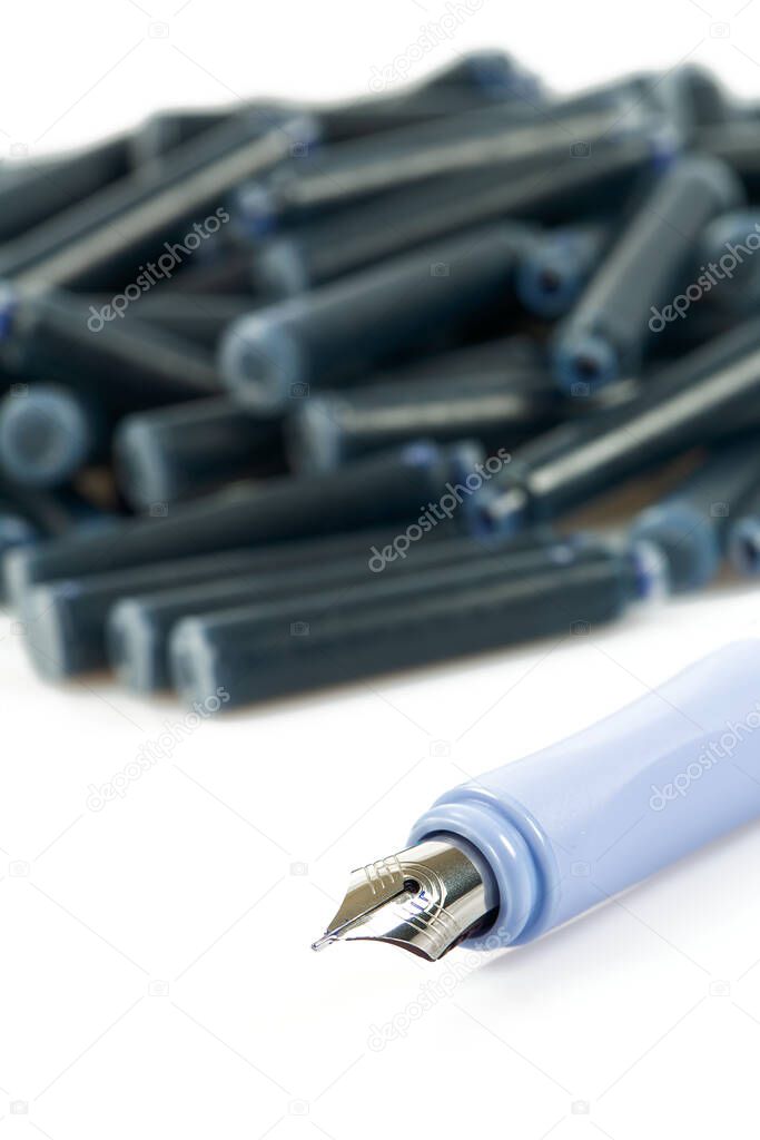 Ink pens and ink cartridges isolated on white background