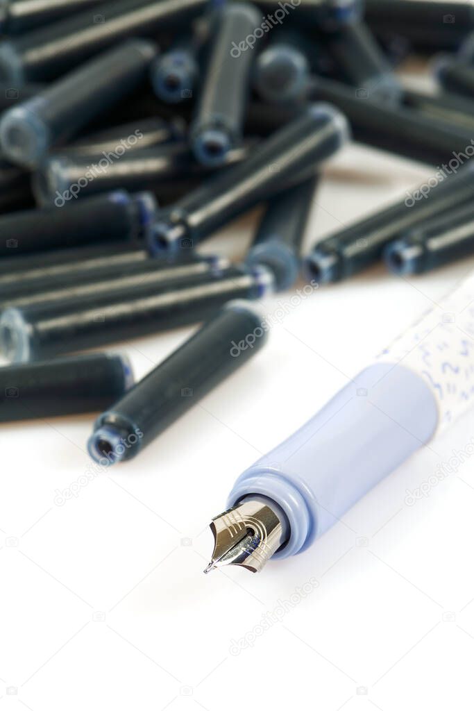 Ink pens and ink cartridges isolated on white background