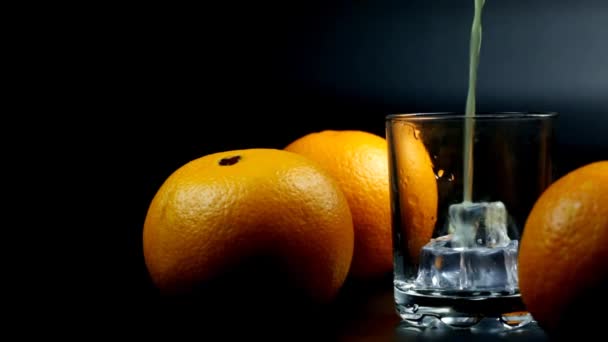 Orange Juice Few Oranges Poured Glass Black Background — Stock Video