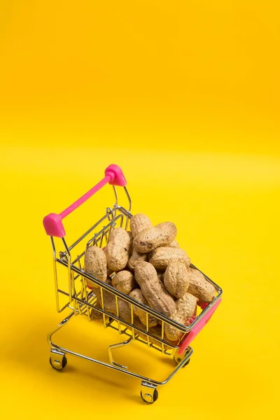 Peanuts Shell Shopping Cart Yellow Background Healthy Food — 스톡 사진