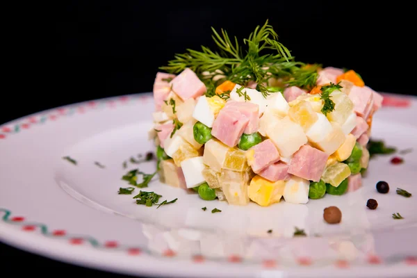 Russian traditional salad Olivier, isolated on black — Stock Photo, Image