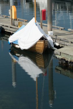 Boat covered by white cover at Point Hudson, Port Townsend